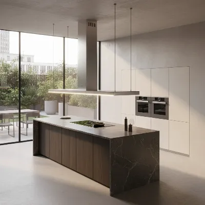 A sleek, minimalist island range hood illuminating a modern kitchen island with a cooktop